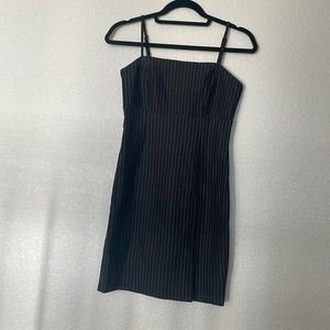 Women’s mini black striped dress.